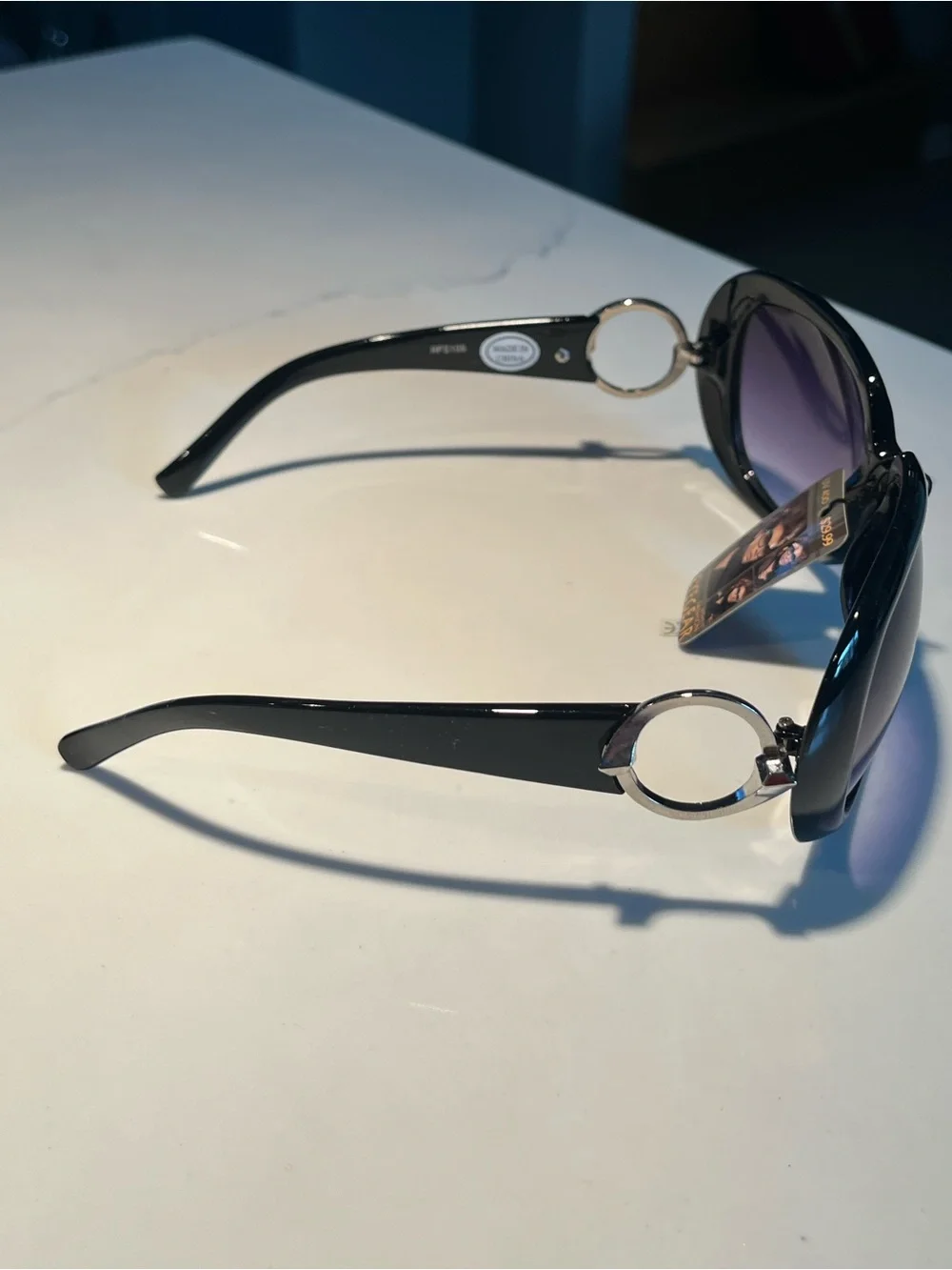 NWT fabulous oversized black sunglasses with violet lenses.